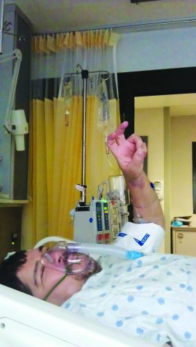 John Medrano gives the TCU hand sign on the way to pre-op just moments before his Oct. 11, 2021, kidney transplant surgery. Courtesy of John Medrano