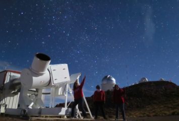 Shown, left to right: graduate student Brianna Smart from the University of Wisconsin-Madision, Jacqueline Antwi-Danso (TCU undergrad), and professor Kat Barger stand in front of the Wisconsin H-alpha Mapper telescope, which measures diffuse light from the Milky Way. The telescope is located at Cerro Tololo Inter-American Observatory (CTIO: http://www.ctio.noao.edu/noao/) in northern Chile. Jacqueline Antwi-Danso traveled to CTIO on a TCU SERC grant (http://www.serc.tcu.edu). Photo courtesy of Kat Barger