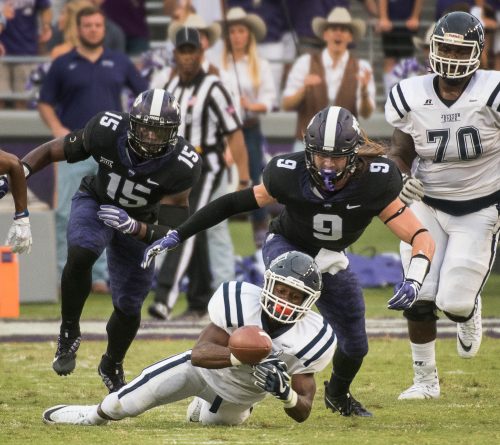Ben Banogu (left, #15) has demonstrated his athleticism every game this season, including this one vs. Jackson State. Matt Bosen (#9) returned to the field after an SMU targeting penalty benched him for the first half of the OSU game. Photo by Glen E. Ellman 