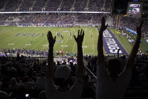 TCU fans celebrate a touchdown in the homecoming game against Kansas. Photo by Leo Wesson
