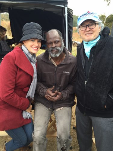 Ron Hall '71 ('73 MBA) (right) and his wife Beth with actor Dijmon Hounsou on the set of the film Same Kind of Different As Me in Jackson, Mississippi.The film is adapted from the bestselling book co-written by Hall and Denver Moore, portrayed by Hounsou in the film. Photo courtesy of Ron Hall