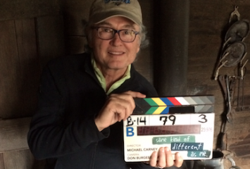 Ron Hall '71 ('73 MBA) holds the clapperboard on the set of the film Same Kind of Different As Me, adapted from the bestselling book he co-authored with Denver Moore. Photo courtesy of Ron Hall