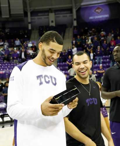Kenrich Williams (left) and Michael Williams smile after receiving their NIT championship rings. The 2016-2017 team reassembled for the ring presentation before the November 10 game against ULM. Photo courtesy of TCU Athletics/Sharon Ellman