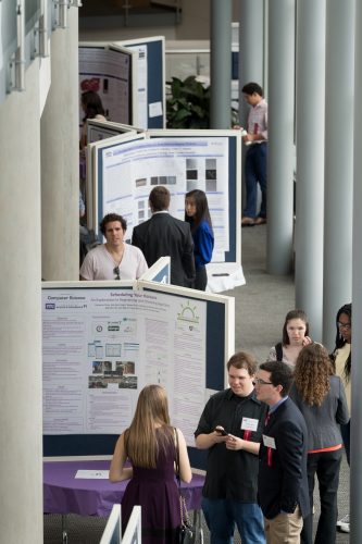 Posters of the symposium projects are a key part of the presentations. One of the senior design teams in the capstone class overhauled the symposium’s website to simplify uploading the posters. Photo by Leo Wesson