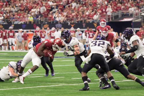 TCU defensive powerhouses fought hard against Oklahoma offense in the league's championship game. Photo by Leo Wesson