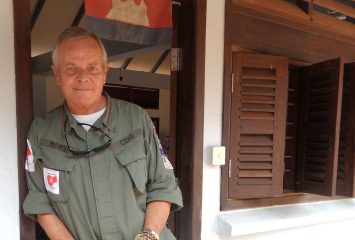 Bill Morse '71, dressed in the fatigues worn by the demining teams of Cambodian Self-Help Demining (CSHD), an organization dedicated to finding and disarming landmines and unexploded ordnance (UXOs) in parts of Cambodia deemed "low priority" by the government's mine-clearing efforts. Photo courtesy of Landmine Relief Fund