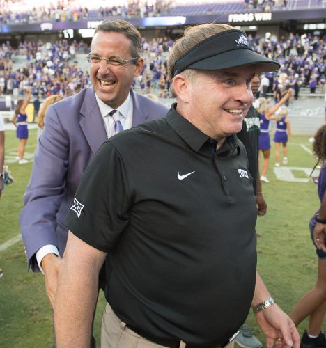 Chris Del Conte (left) served as TCU's director of intercollegiate athletics since 2009. He oversaw a series of historic moments for TCU Athletics including the move to the Big 12 Conference, over $300 million in donor-funded construction projects and building community support. Photo by Glen E. Ellman