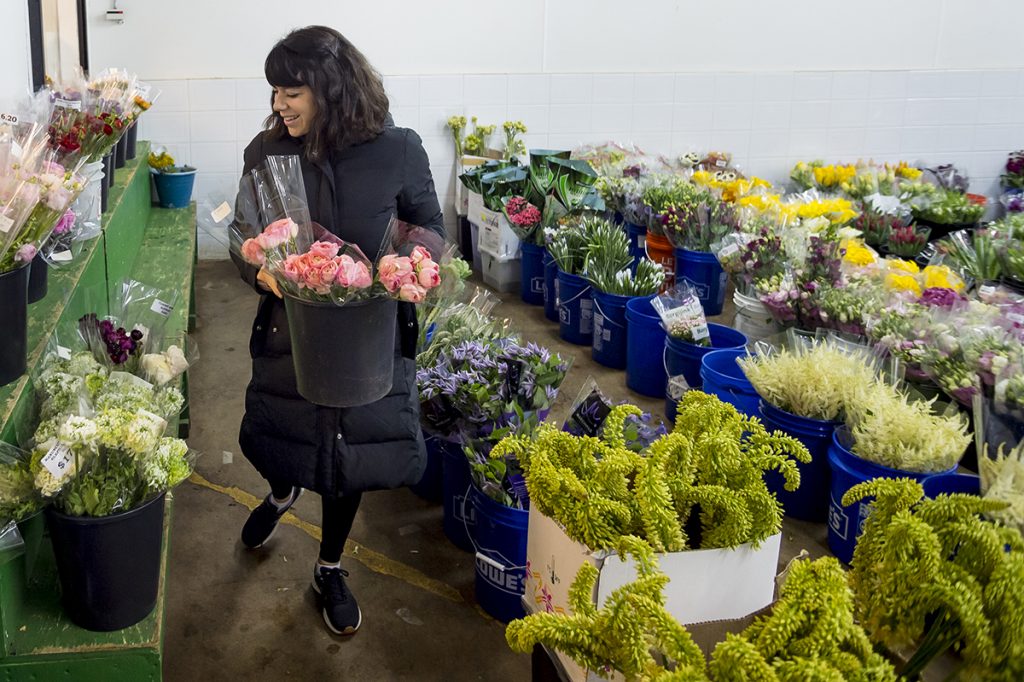 A living palate: At a Dallas floral wholesaler, Rico carefully selects the materials for her creations. Photo by Leo Wesson
