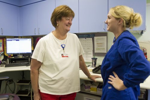 Dr. Nancy Dambro laughs with Madison Gibson, an RN at Cook Children's Hospital in Fort Worth. Photo by Mark Graham