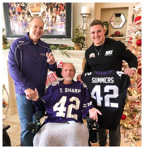 Tommy Sharp (center) shows off his #42 jersey with longtime friend Billy Tommaney and TCU linebacker Ty Summers. Photo courtesy of Billy Tommaney.