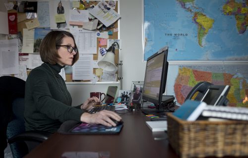 As evidenced by the maps on her office wall, Boyd takes on worldwide issues, which includes hosting the event Think Global, part of TCU’s Discovering Global Citizenship program. Photo by Leo Wesson