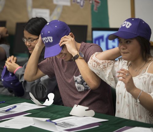 At Trimble Tech High School, just a few miles from the TCU campus, a new class of Community Scholars is welcomed. From left, Mikayla Wilson, Niang Muang and Gisselle Galvan. Photo by Leo Wesson
