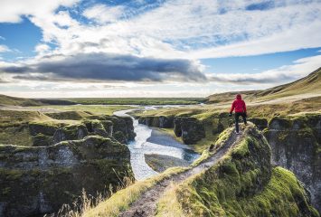 Getty images © Andrea Comi. Fjadrargljufur, Iceland, Europe. A man admires the panorama