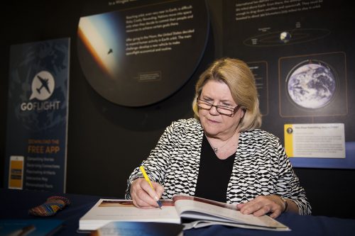 At the Smithsonian National Air and Space Museum, curator and chair of the Space History Department Valerie Neal '71 signs copies of her books. Photo by Lisa Helfert