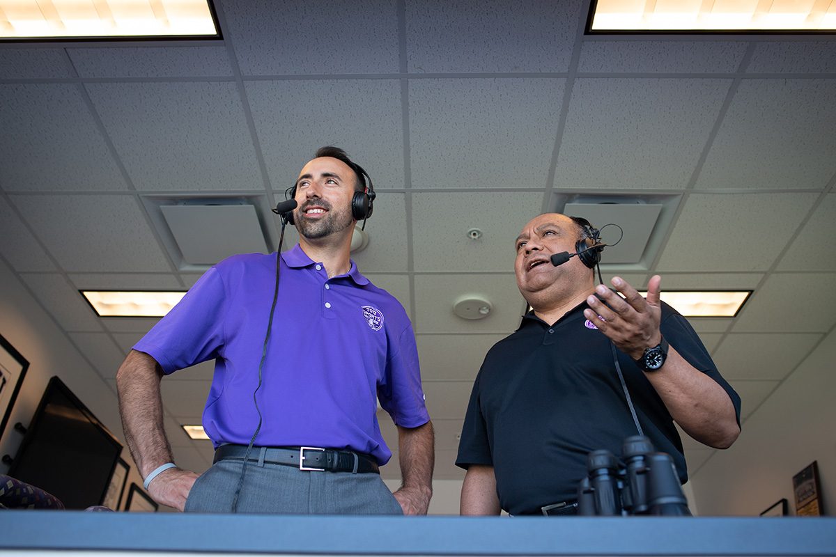 Elvis Gallegos (left) and Miguel Cruz bring TCU football to Spanish speakers. Photo by Leo Wesson
