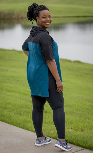 Jennifer James shows off one of her clothing designs on a running path. Photo by Robert W. Hart
