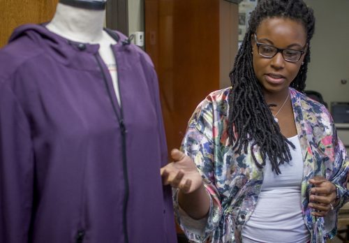 Jennifer James talks with her team at the Sharon Young Group at their Dallas, TX facility about the high-quality fabric used in her active wear line Active Ego. Photo by Robert W. Hart