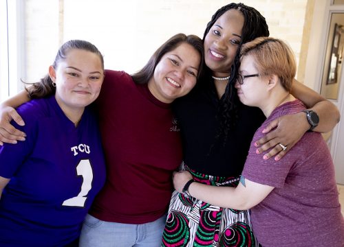 From left: My Le, Thi Nguyen, Timeka Gordon and Nikki Nguyen. Gordon is the director of inclusiveness and intercultural services and the Community Scholars Program, and the sisters regard her as their “TCU mom.” Photo by Joyce Marshall