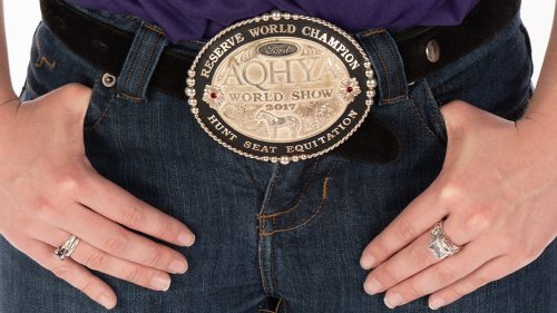 Detail of Laska Anderson's belt buckle from AQHYA (American Quarter Horse Youth Association) World Show 2017, inscribed "reserve world champion" and "hunt seat equitation." Photo by Glen E. Ellman
