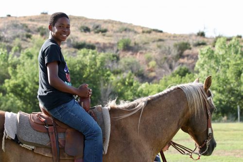 At Camp New Day, campers with diabetes like Malachi, 12, enjoy activities such as fishing, horseback riding and swimming. Courtesy of Alison Lunsford/Diabetes Foundation of the High Plains