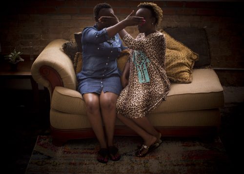 Twin sisters conceal their identities in the apartment they will live in for up to six months after they receive their work permits. Photo by Joyce Marshall