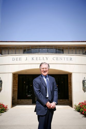 Dee J. Kelly '50 in front of the "old" Dee J. Kelly Alumni & Visitors Center in June 2013. Photo by Amy Peterson