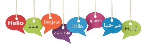 Speech bubbles contain the word HELLO in eight different languages. English, Spanish, French, Japanese, German, Russian, Arabic and Swedish. International business, translation services etc.