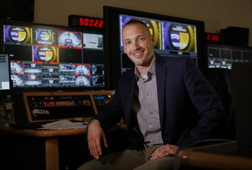 Dustin Hahn, assistant professor of film, television and digital media, analyzed how the usage of statistics changed in NFL broadcasts since the 1970s. His work sheds light on the evolution of sports broadcasting as well as the psychological dimensions of sports fandom. Photo by Ross Hailey