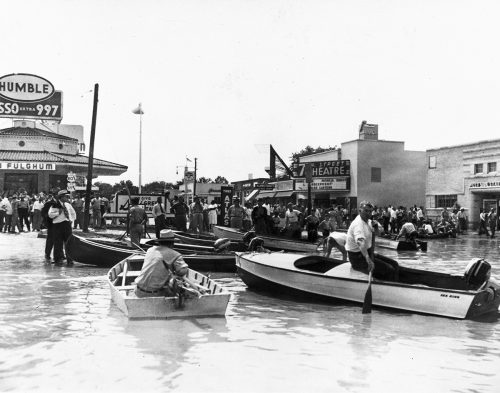 Flooded intersection at University and 7th St., Fort Worth, with people in boats in front of 7th Street Theater, May 1949. Courtesy, W. D. Smith Commercial Photography Collection, Special Collections, The University of Texas at Arlington Library, Arlington, Texas
