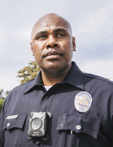 LAPD Sergeant Sai Tuialli photographed at the Pueblo del Rio housing project in South Los Angeles. The development is home to the 52 Pueblo Bishop Bloods street gang and is an area that Tuialli is often called to respond to calls about gang parties and gunshots. Photo by Christina Gandolfo