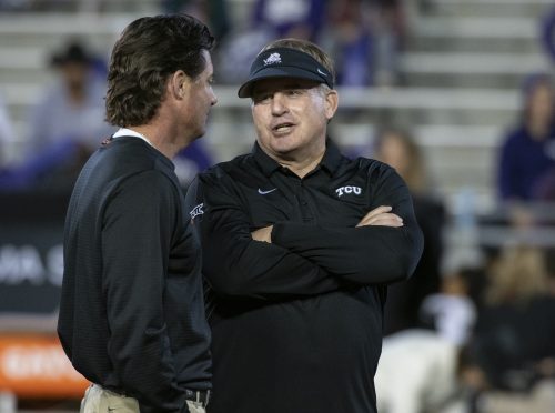 Gary Patterson and Mike Gundy chat before the TCU vs. Oklahoma State football game on November 24, 2018. The Frogs won, 31-24.