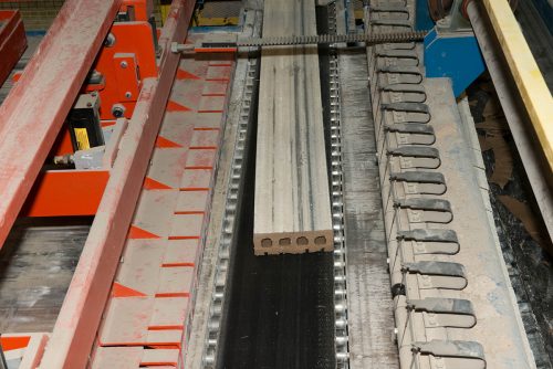 At an Acme Brick plant, one long column of brick is formed before being cut to size. Courtesy of Acme Brick Co.