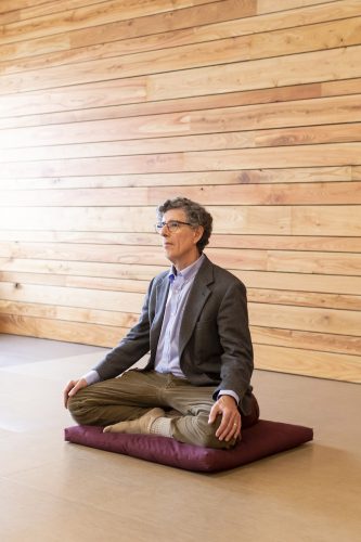 RichardDavidson, founder and director of the Center for Healthy Minds at the University of Wisconsin-Madison, leads a guided meditation group at the Center. Photo by Andy Manis