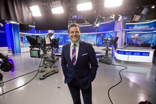 Russ McCaskey, on the set of KTVT-TV's This Morning, studied business before finding his passion in journalism. Photo by Mark Graham