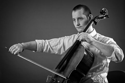 Musicians who play their instrument from a seated position, such as cellist Manuel Papale, have to consider posture in a different way than standing musicians. Photo by Ross Hailey