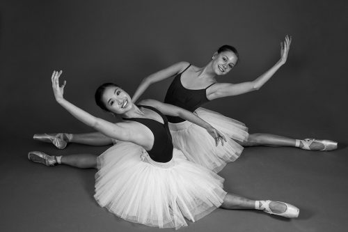 Dancers such as Lauren Huynh (front) and Abby Linnabary rely on cool-down time to recharge for the next performance. Photo by Ross Hailey