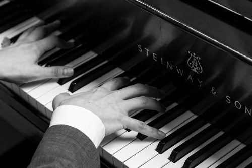 Historically, pianos weren't designed for different hand widths, but having a more ergonomically-friendly piano could mean the difference between hand pain and no hand pain. Photo by Ross Hailey
