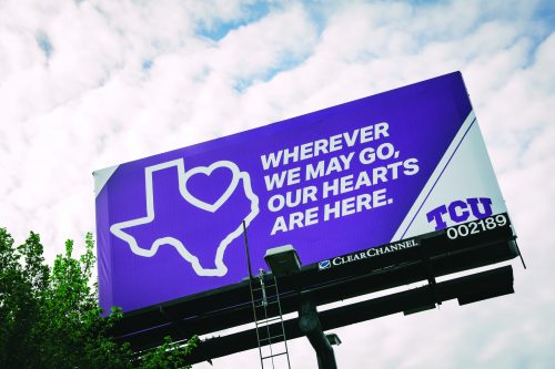 After classes moved to online-only instruction due to COVID-19 concerns, the billboard on University and Park Hill was switched to let all know that "Wherever we may go, our hearts are here". Photo by Amy Peterson.
