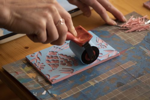 Artist Alex Hughes '12 makes block prints in her studio in Richardson.