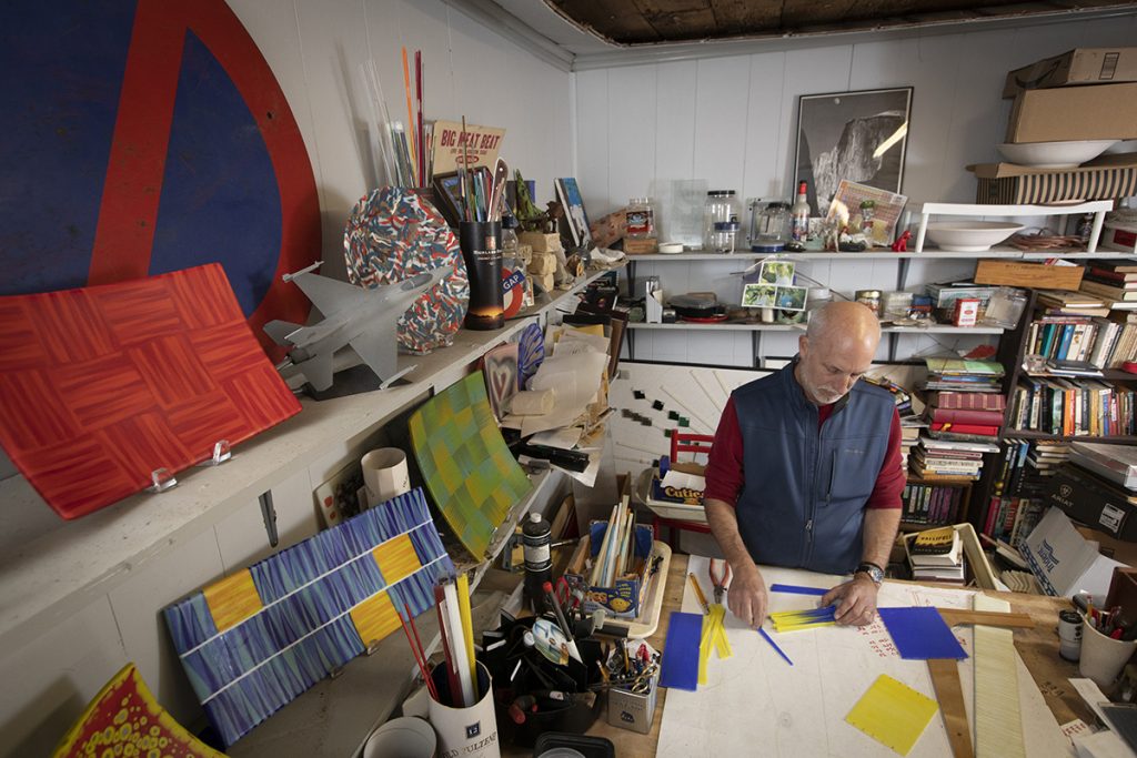 Gary Satz '84 unwinds by making fused glass art work in the form of bowls, plates and picture frames at his home studio in Fort Worth. He creates his works by assembling pieces of glass in shapes and melting them together in a kiln with precisely controlled temperature. The glass can be molded to forms in the kiln, and grinding and poishing afterwards provides the desired surface finish. Photographed January 25, 2020 by Rodger Mallison