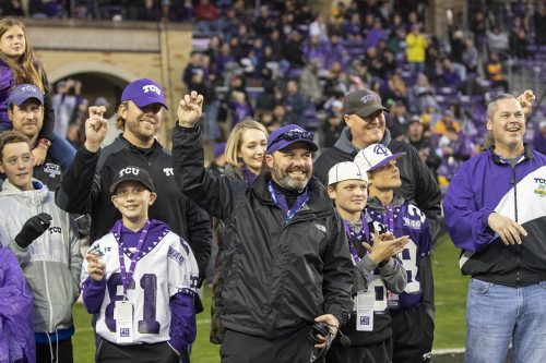 Landry Burdine joins fellow members of TCU's victorious 1998 Sun Bowl team during a halftime recognition at the West Virginia vs. TCU game, November 29, 2019. Photo by Rodger Mallison