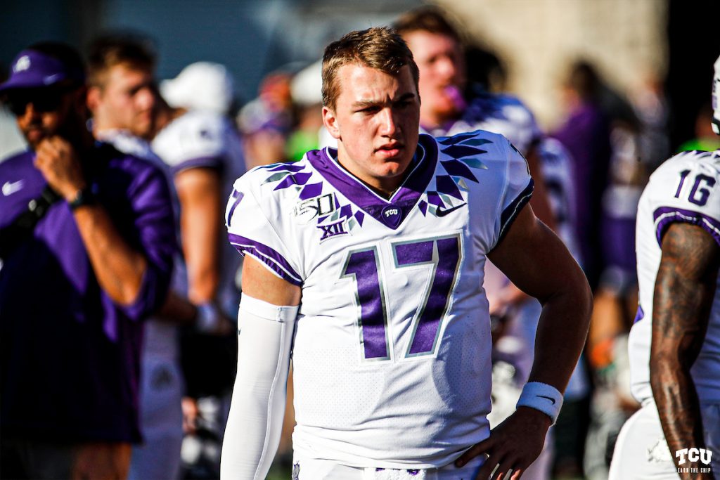 Michael Downing in his football uniform standing on the sidelines. Courtesy of TCU Athletics