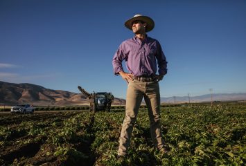 John Moore III surveys recently harvested potato fields at his family's farm in Arvin, CA. Moore is a 4th generation farmer.