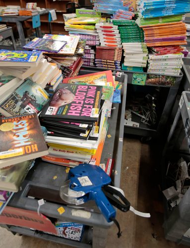 Books in the work area at the Half Price Books flagship store on Northwest Highway in Dallas, TX on July 23, 2020. Photo by Ross Hailey