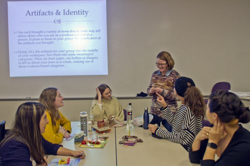 Jo Beth Jimerson, associate professor of education, working with students L to R: Andrea Neira, Virginia Puckett, Molly Swank, Chandler Lotridge and Christine Rodriguez during one of her classes. The instructions for the class is projected on the wall. Photo by Mark Graham, November 12, 2019