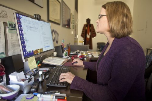 TCU College of Education associate professor Jo Beth Jimerson works in her office on November 14, 2019. Jimerson is an expert on applying big data sets and the scientific method to improve school leadership. Photo by Mark Graham