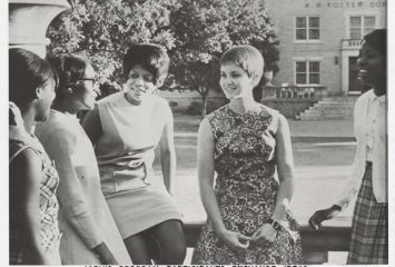 An article in the TCU student newspaper depicts four Black Jarvis Christian College students talking to one white TCU student.