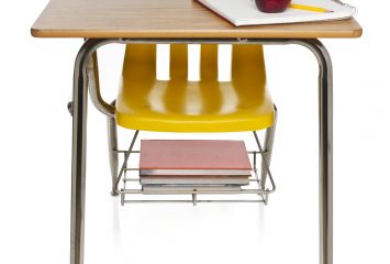 A school desk with an attached chair
