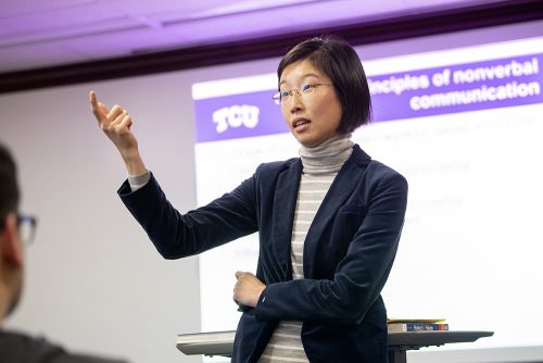 Jie "Jackie" Zhuang, assistant professor of Communication Studies, teaches a classroom full of students. (AP Photo/Jeffrey McWhorter)