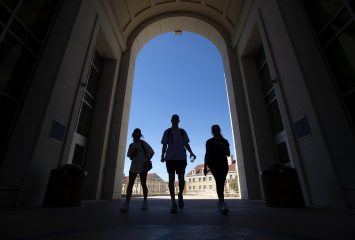 Students silhouetted in the archway between Marion and Clark halls in TCU's Worth Hills. Photographed Thursday, March 21, 2019. (AP Photo/Jeffrey McWhorter)